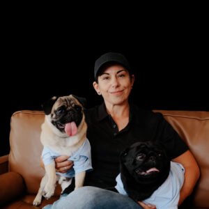 Brachy Breeze founder Jamie Gragg with pugs